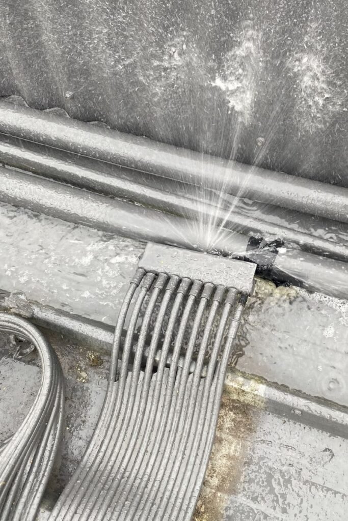 Pool solar heating leak with water spraying from pipe